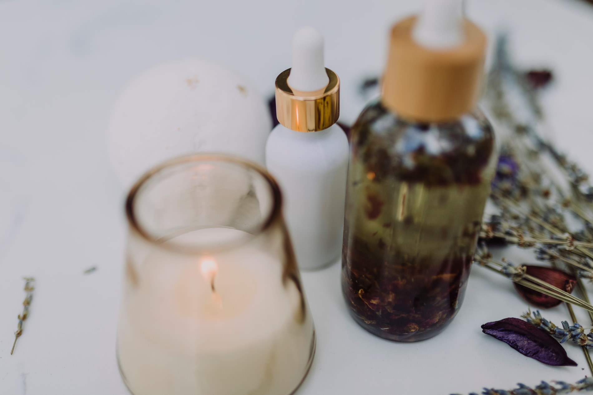Spa oils, candle, and botanicals